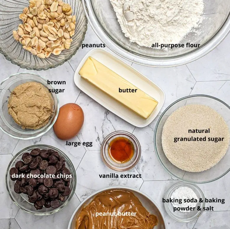 Ingredients for peanut butter spider cookies including flour, peanut butter, mini peanut butter cups,